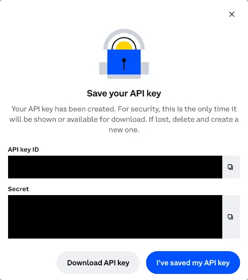 Coinbase Save your API key dialog with the key ID and secret hidden